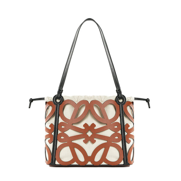 Fashionable laser cut genuine leather tote inner pouch included lightweight and durable ideal woman bag